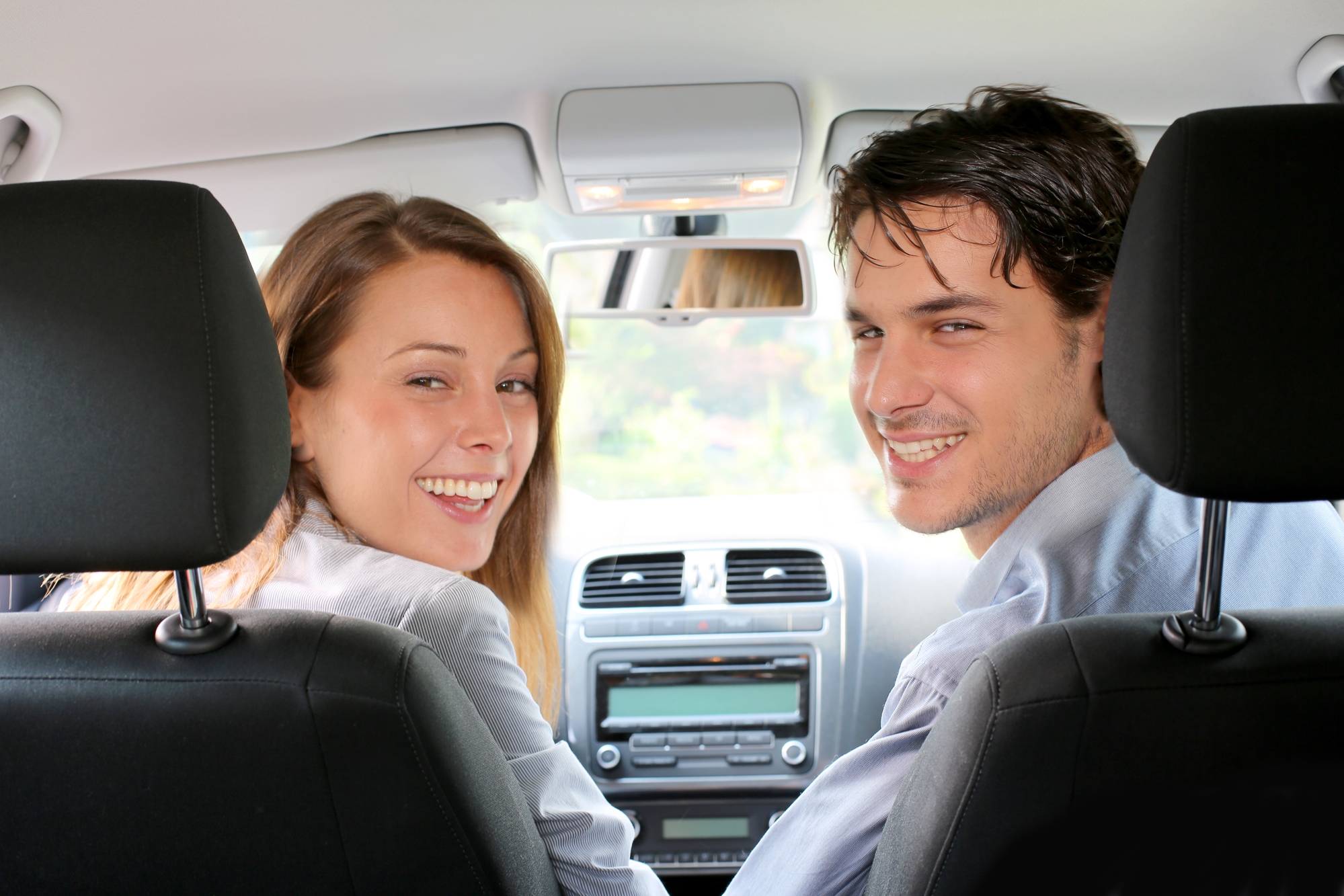 Back View Of Couple Driving Car Rothenberger Insurance Services